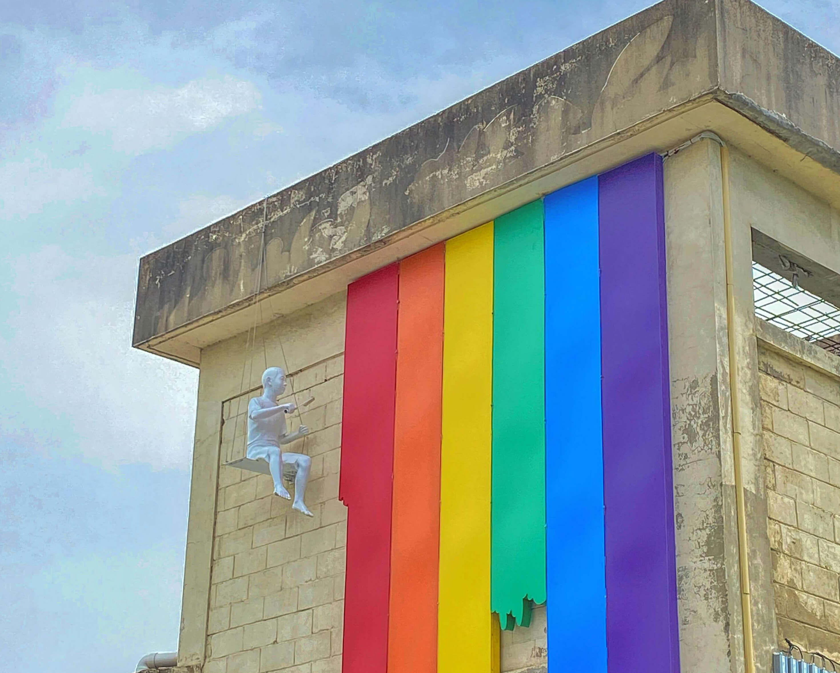 LGBT flag on building - life coach, motivation and recovery coach